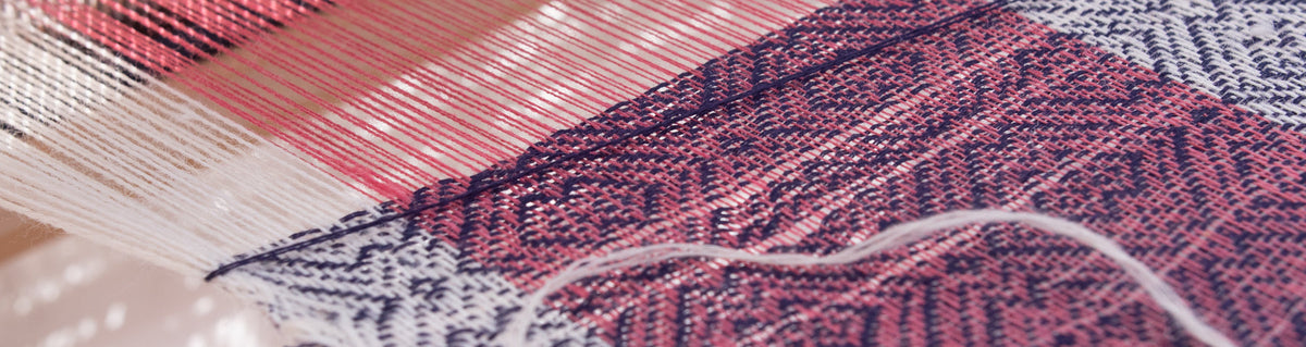 Detail, a pashmina scarf on a loom.