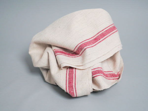 Serviette tissée main : coton écru avec bord rose