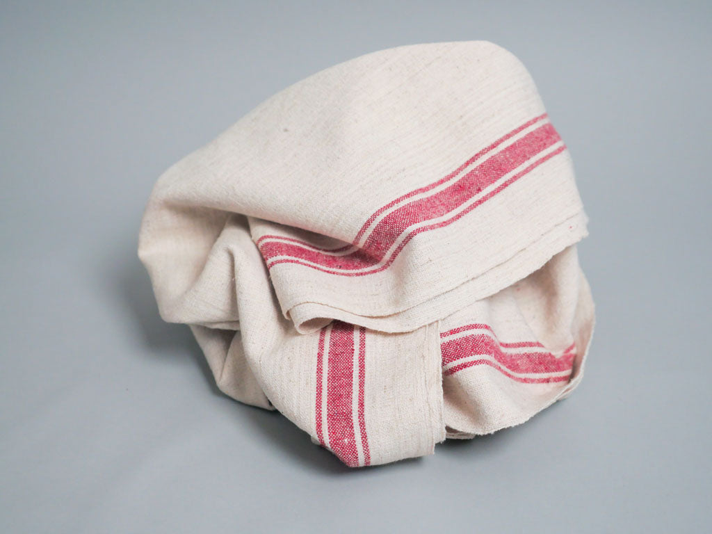 Serviette tissée main : coton écru avec bord rose
