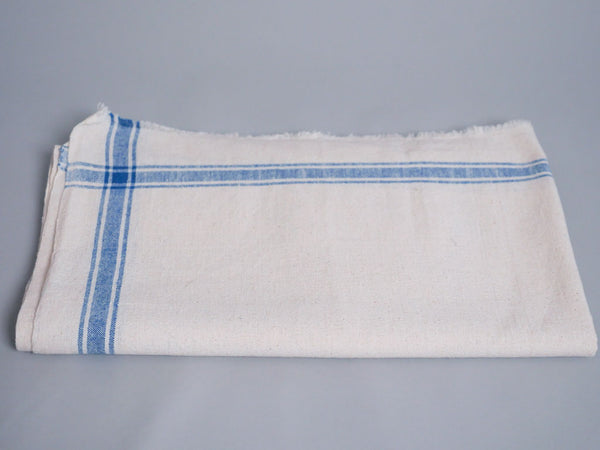 Serviette tissée main : coton écru avec bord bleu
