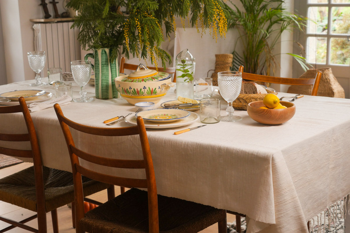 Hand woven table cloth in recycled cotton.